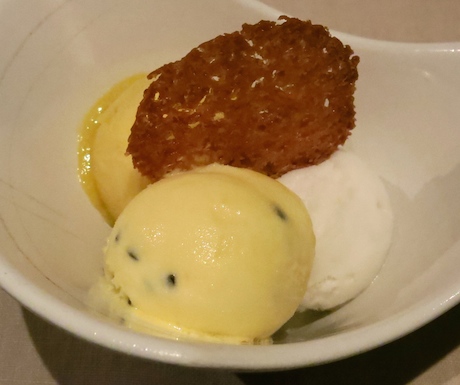 Passion fruit, lemongrass and mango sorbet with a vegan coconut sugar biscuit.