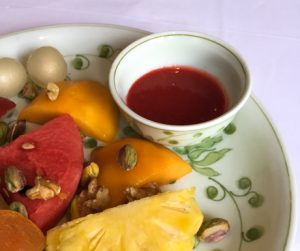 Tropical fruit plate with strawberry sauce